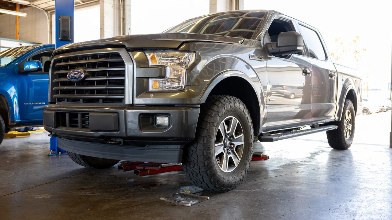 Ford F-150 pickup truck in service bay at Network Automotive